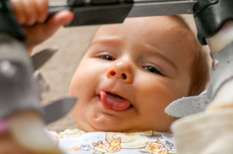 Baby smiling after frenectomy