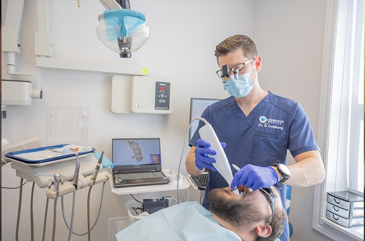Dentist using digital imaging for dental treatment planning