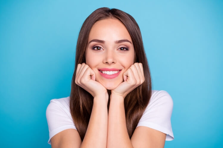 Woman sharing flawless smile after makeover