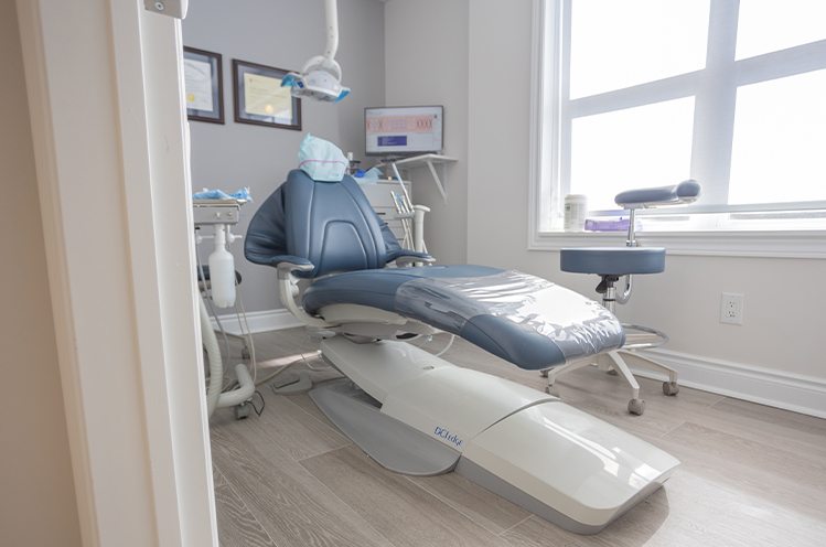 Dentist explaining the four step dental implant process