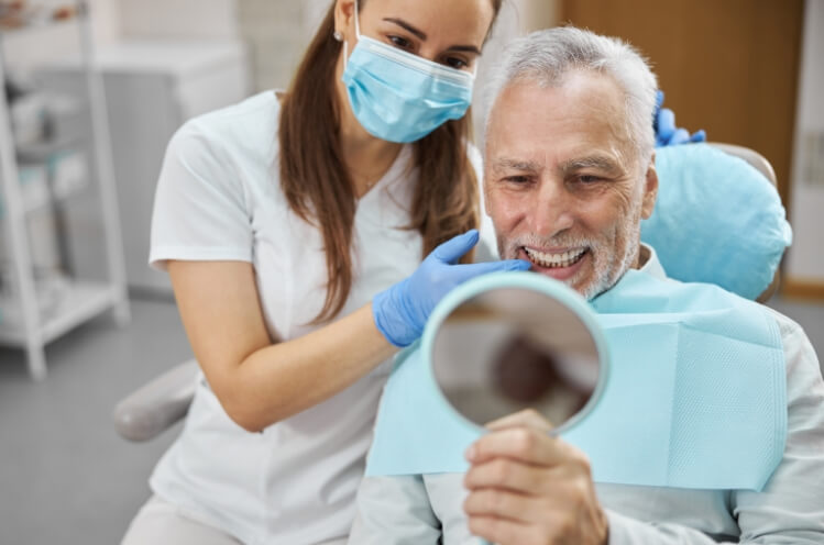 Man looking at smile in the mirror