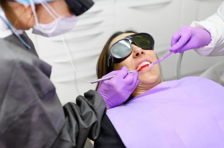 Dental patient receiving laser periodontal therapy