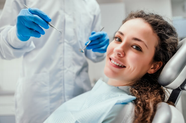 Woman smiling during Family dentistry checkup and teeth cleaning visit