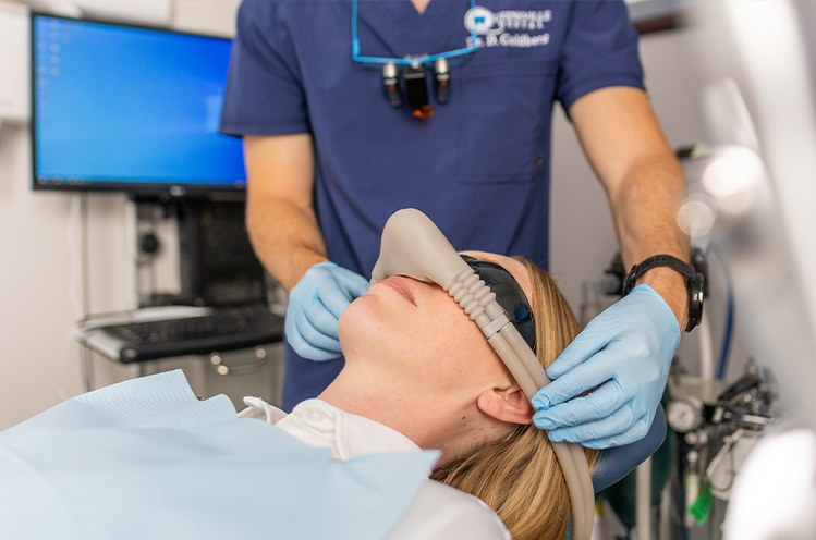 Dental patient receiving treatment under nitrous oxide dental sedation