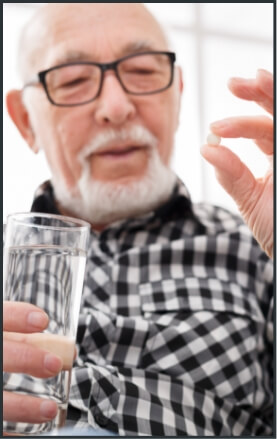 Man taking oral conscious sedation dentistry pill