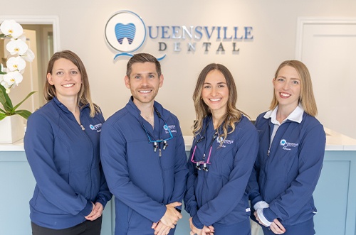 woman flossing for teeth whitening in East Gwillimbury